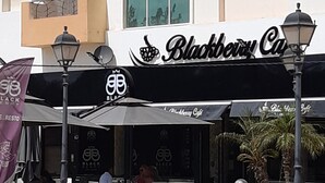 A building with a storefront labeled "Blackberry Cafe." - Seaside (200m to beach), bright, spacious ground floor apartment, Les Dunes S+2 (Akouda)