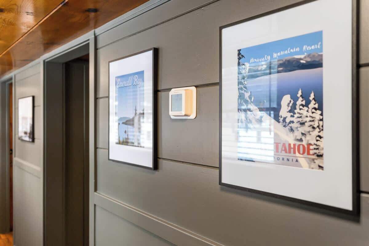 Framed pictures on a wall, including one with the text "Tahoe California."