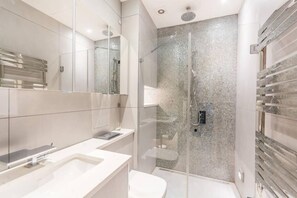 Bathtub, hair dryer, towels, soap