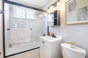 Shower, hair dryer, towels