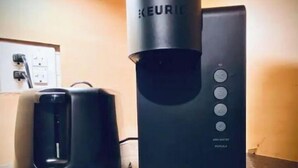 A coffee maker with a water reservoir on a countertop. - Cozy Studio minutes from Flathead Lake (Bigfork)