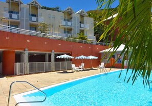 2 outdoor pools, open 8:00 AM to 7:00 PM, pool umbrellas, pool loungers