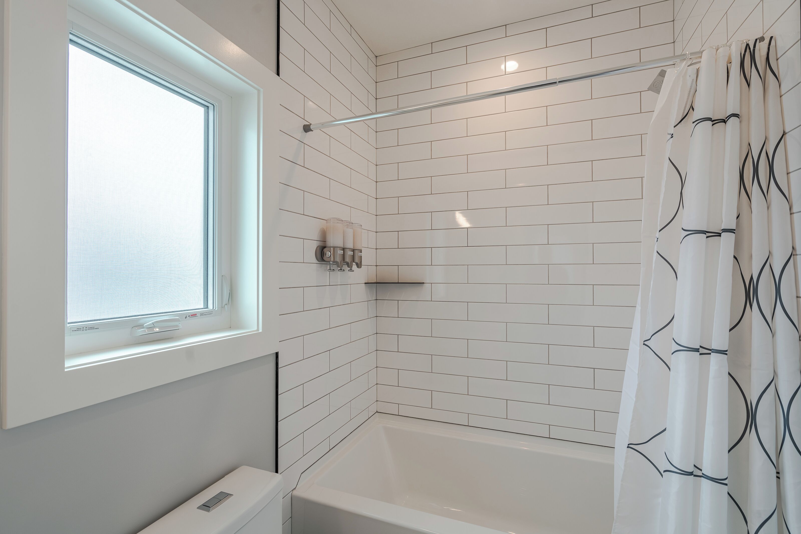 Combined shower/tub, hair dryer, towels, soap
