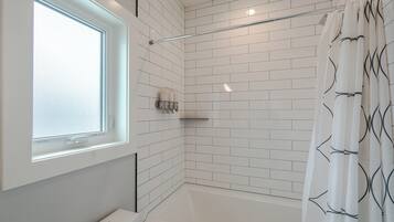 Combined shower/tub, hair dryer, towels, soap