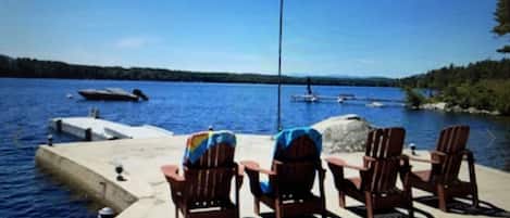 Relax on the lakeside dock with Adirondack chairs and enjoy the peaceful surroundings.