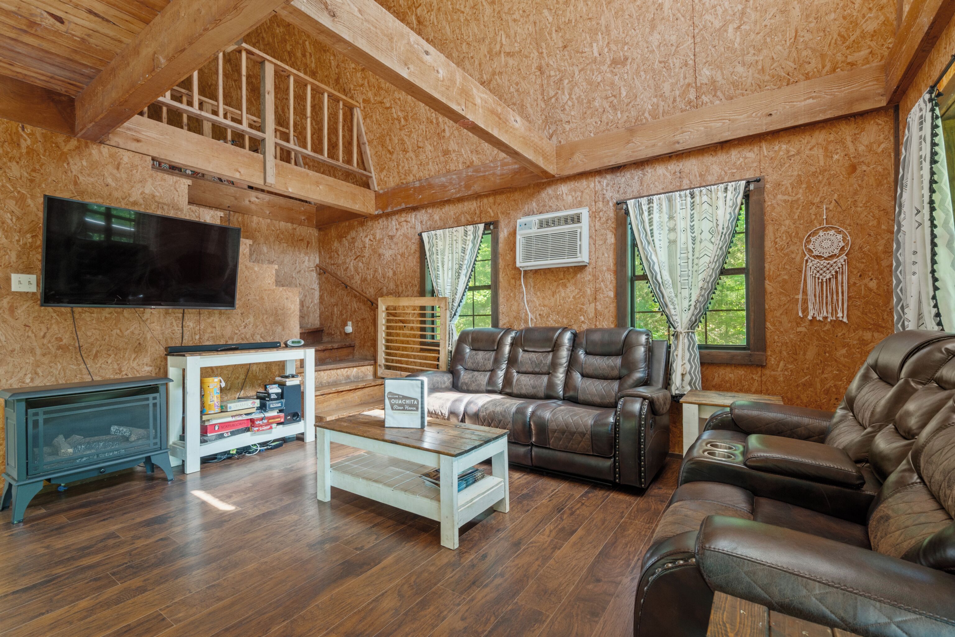 Windchimes Cabin | Living area | Flat-screen TV
