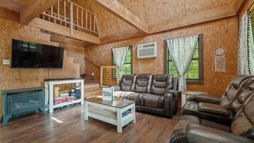 Windchimes Cabin | Living area | Flat-screen TV