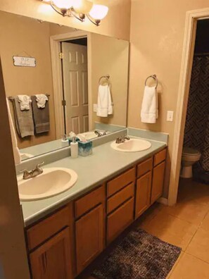 Combined shower/tub, hair dryer, towels, soap