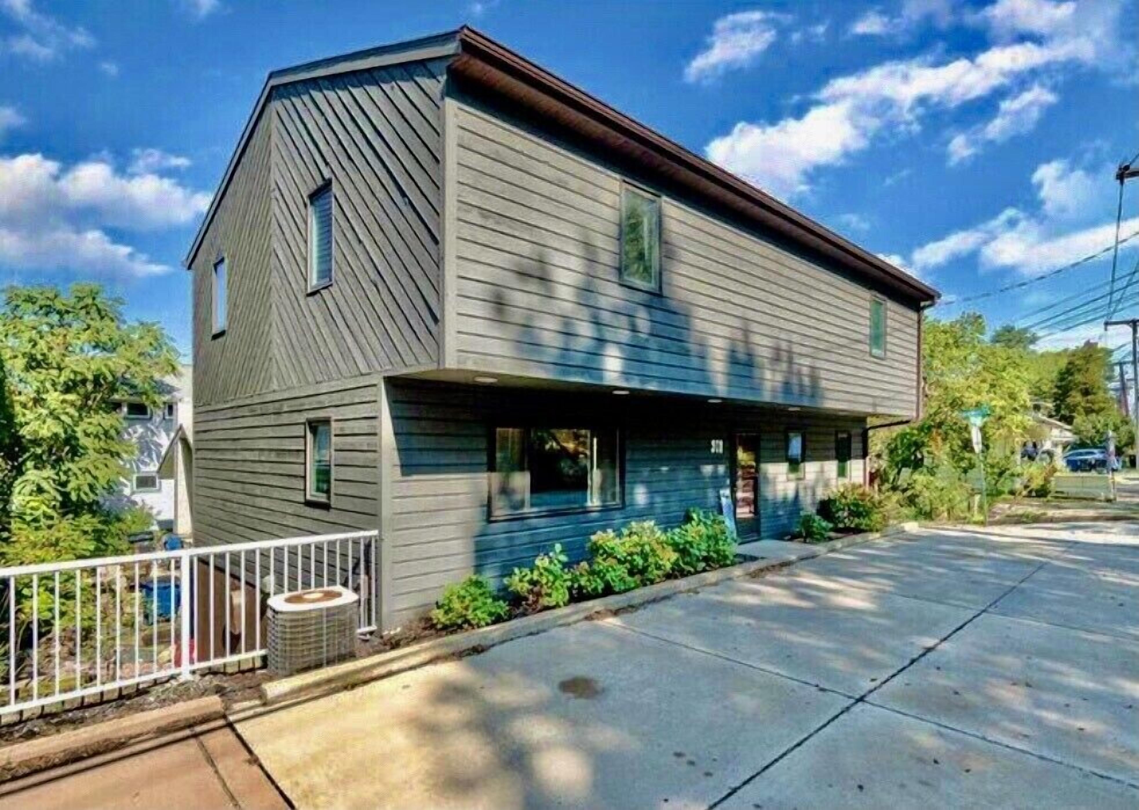 Steps away from the pristine sands and blue waters of Lake Michigan.