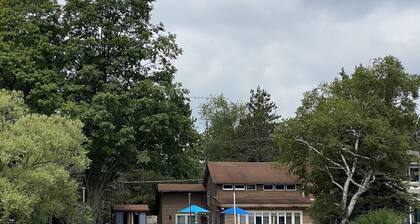 Every season home. Snow to summer's glow. A lakeside delight. Feels just right.