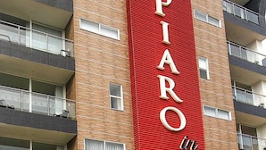 A multi-story building with a prominent red vertical sign that reads "APARTMENT". - A spacious and fabulous   387 ft2 studio, near every thing in Cali (Cali)