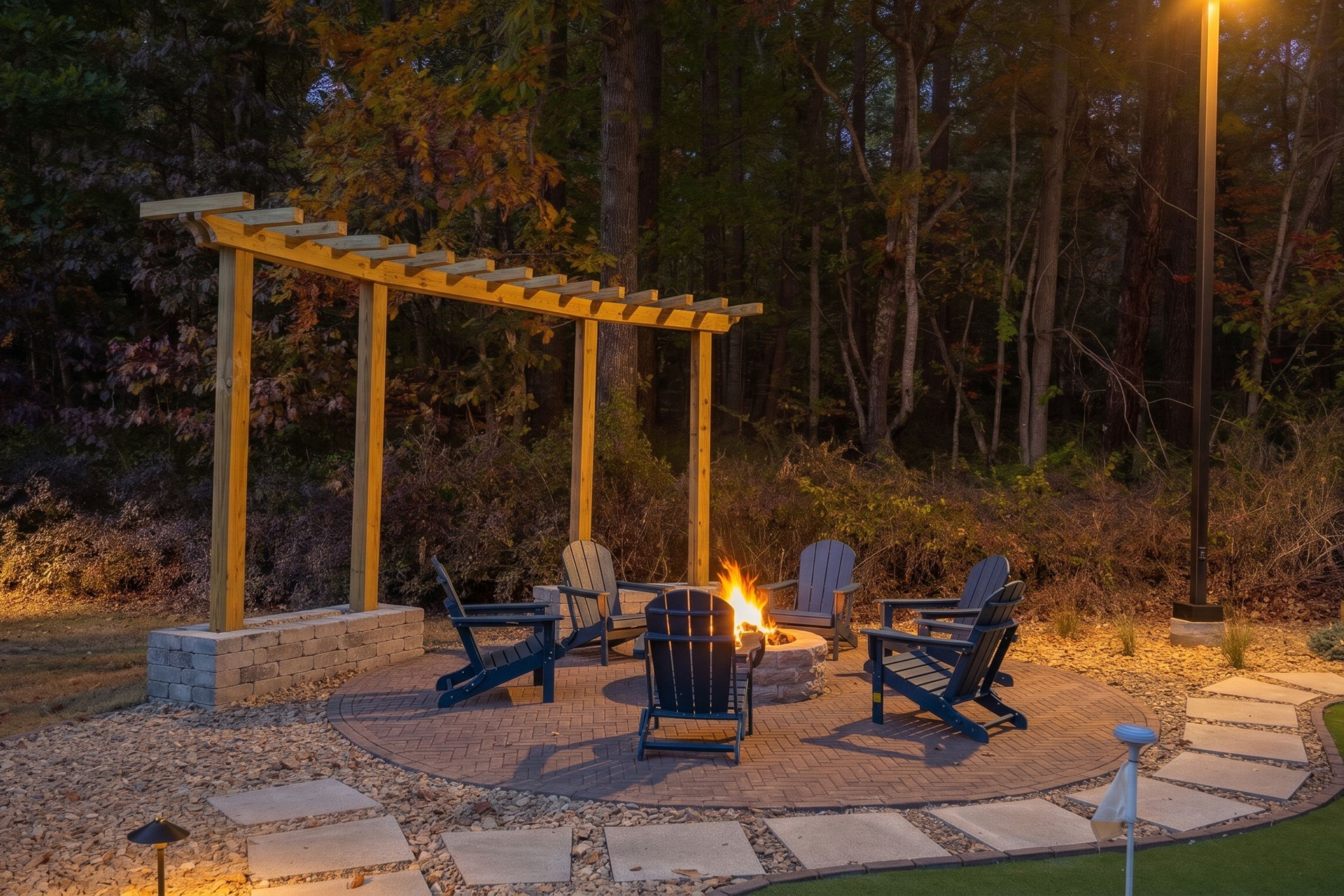 An outdoor patio with Adirondack chairs, a fire pit, and a pergola structure.