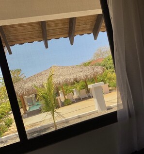 Premium bedding, pillow-top beds, free WiFi, bed sheets - Tao Destinations (Tamarindo)