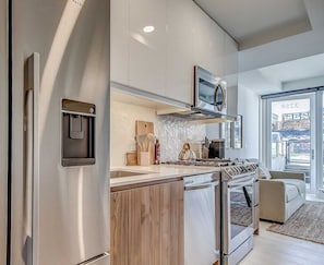 Fridge, microwave, oven, stovetop - Timeless & Contemporary Condo in Kensington with Large Patio (Calgary)