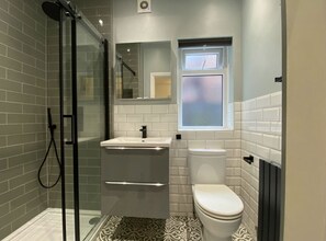 Combined shower/tub, hair dryer, towels, soap