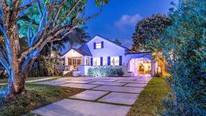 A two-story house with a paved driveway and a well-maintained lawn. - 2 CLEAN Houses! 3bd/2ba & 1bd/1ba guest house in safe area close 2 everything  (Miami)