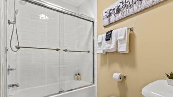 Combined shower/tub, hair dryer, towels, soap
