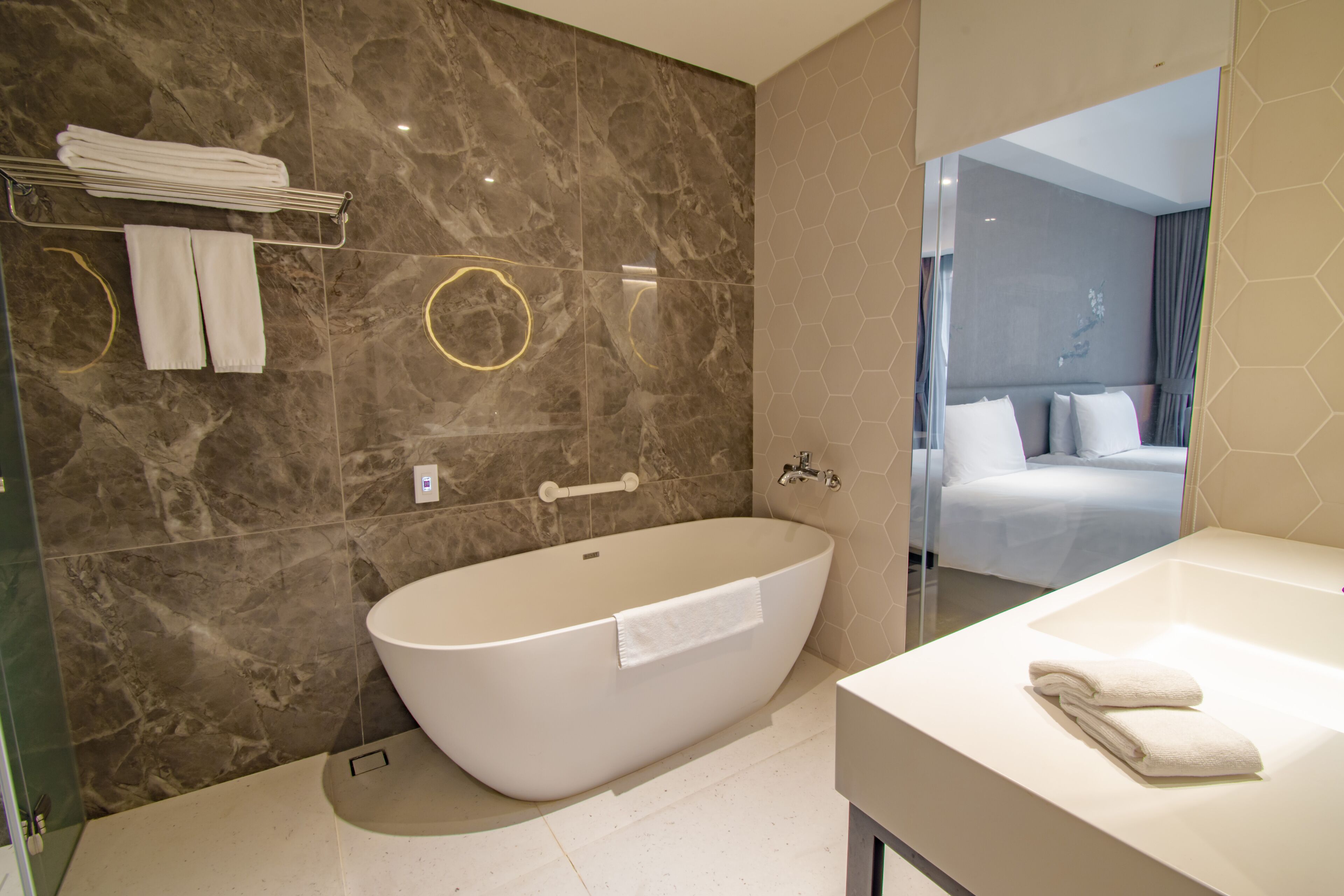 standard twin room | bathroom | separate bathtub and shower, deep-soaking bathtub, rainfall showerhead
