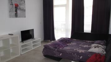 Superior Apartment | Down comforters, individually furnished, blackout drapes, free WiFi