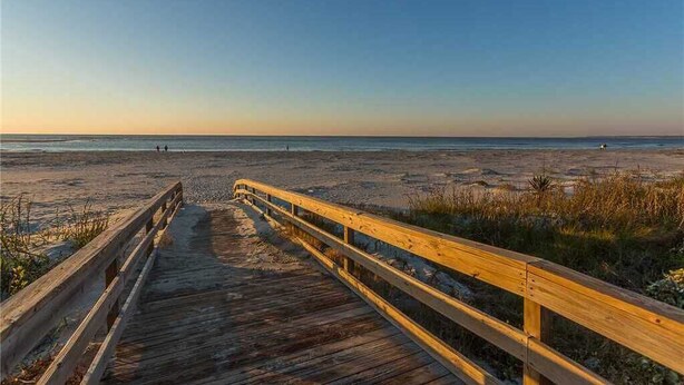 A wooden boardwalk leading to a beach with a clear sky. - St. Simons Beach Club, Oceanfront Pool, Fabulous Beach Access and More! (Saint Simons Island)