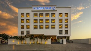 A modern hotel with a prominent sign reading "GOLDEN TULIP." - Golden Tulip Jalandhar (Jalandhar)