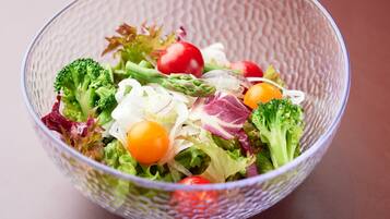 A clear view of a salad bowl with various vegetables.