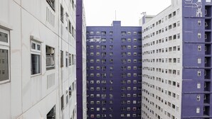 A multi-story building with a grid of windows and balconies. - Homey And Cozy Stay 2Br At Green Pramuka City Apartment (Jakarta)