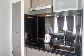 Room | Private kitchen | Fridge, stovetop, cookware/dishes/utensils - Exclusive And Comfy Studio Room Apartment At Taman Melati Surabaya (Surabaya)