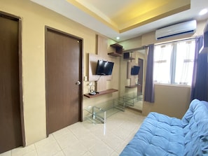 Room | Living room | TV - Well Furnished 2Br At Suites @Metro Apartment (Bandung)