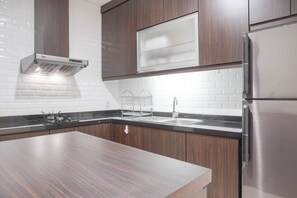 Room | Private kitchen | Fridge, microwave, stovetop, dishwasher - Comfort And Minimalist 3Br Apartment At Bellagio Residence (Jakarta)