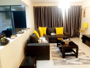 Apartamento, 2 quartos | Área de estar