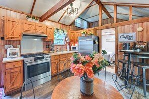 Fridge, microwave, stovetop, coffee/tea maker