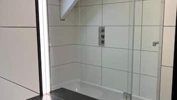 Combined shower/bathtub, hair dryer, towels, soap