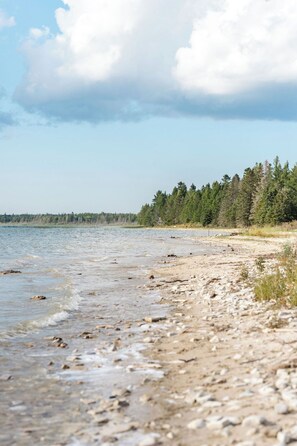 On the beach - Bayside Bungalow: Cozy Lakefront Living with Winter Fun Just Outside! (Hessel)