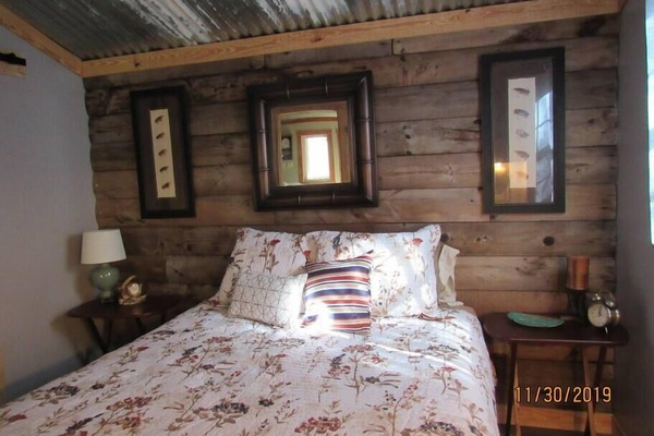 Master bedroom with queen size bed.