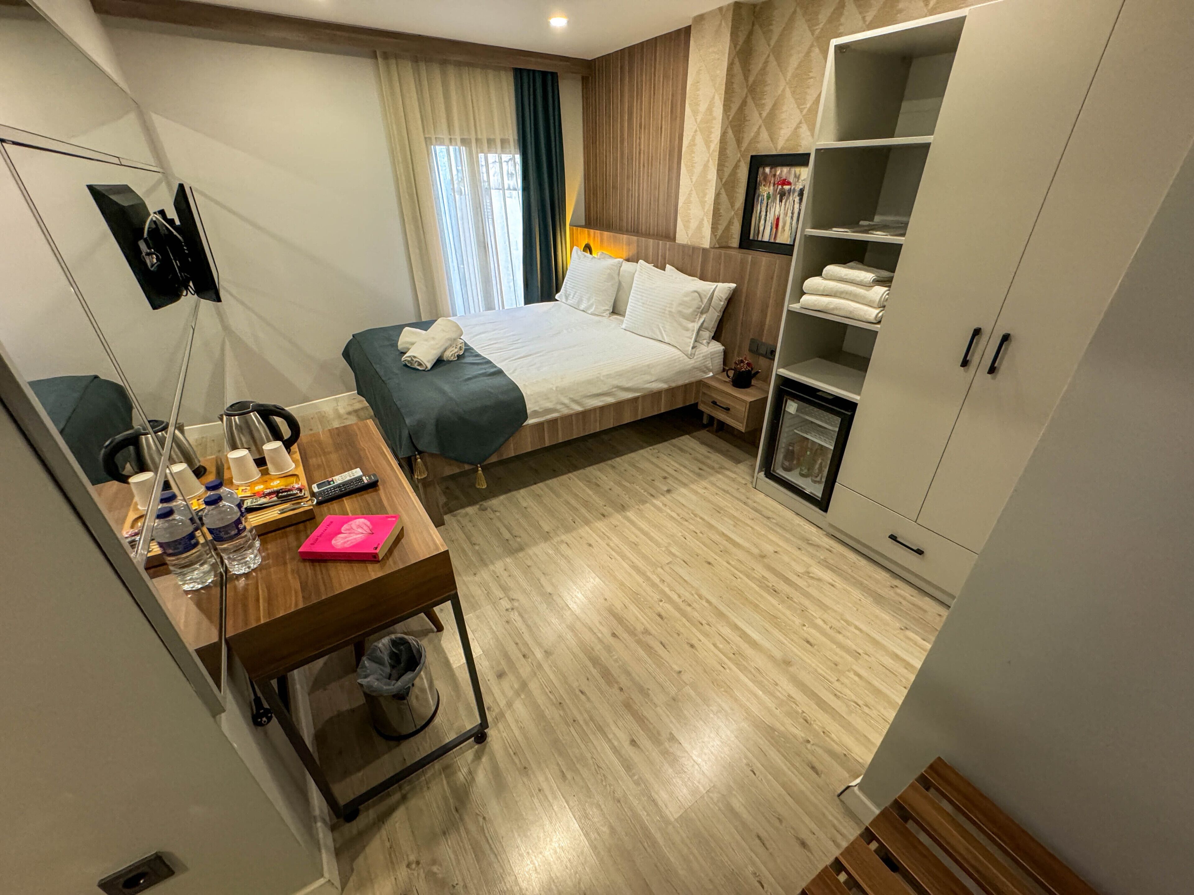 economy room | premium bedding, minibar, desk, laptop workspace