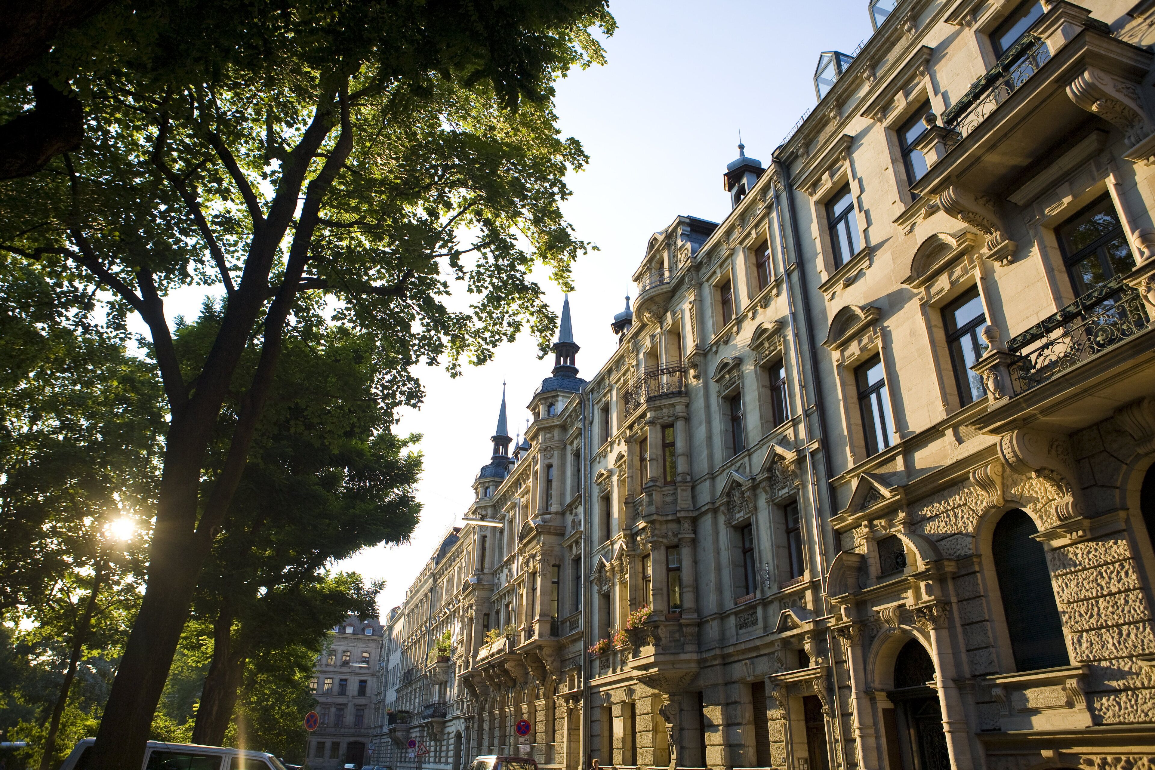 A historic building with ornate architecture, large windows, and a prominent tower.