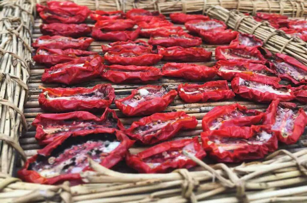 A basket filled with dried red peppers.