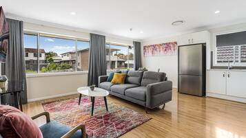 Family Apartment | Living room | 50-inch flat-screen TV with digital channels, TV