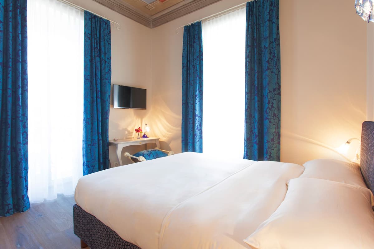 Standard Double Room | Down comforters, minibar, in-room safe, individually decorated