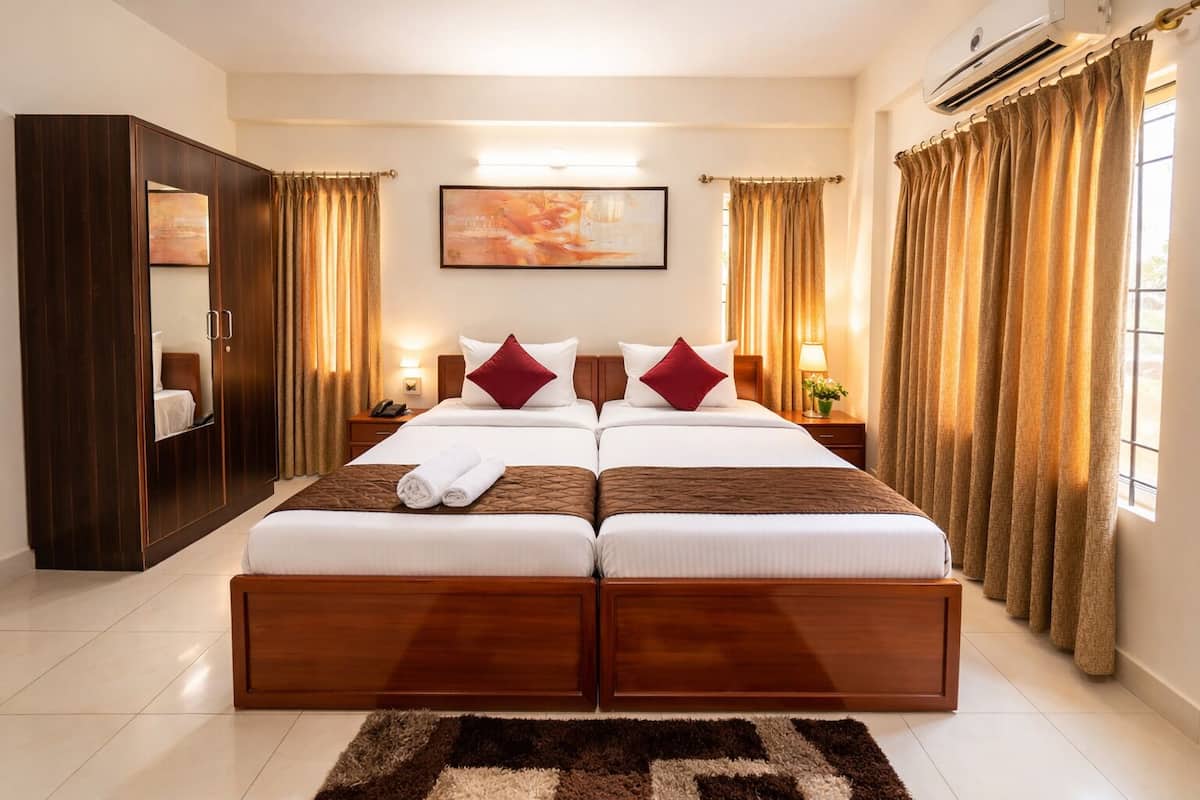 Chambre Deluxe avec lits jumeaux | Draps en coton égyptien, literie de qualité, décor unique