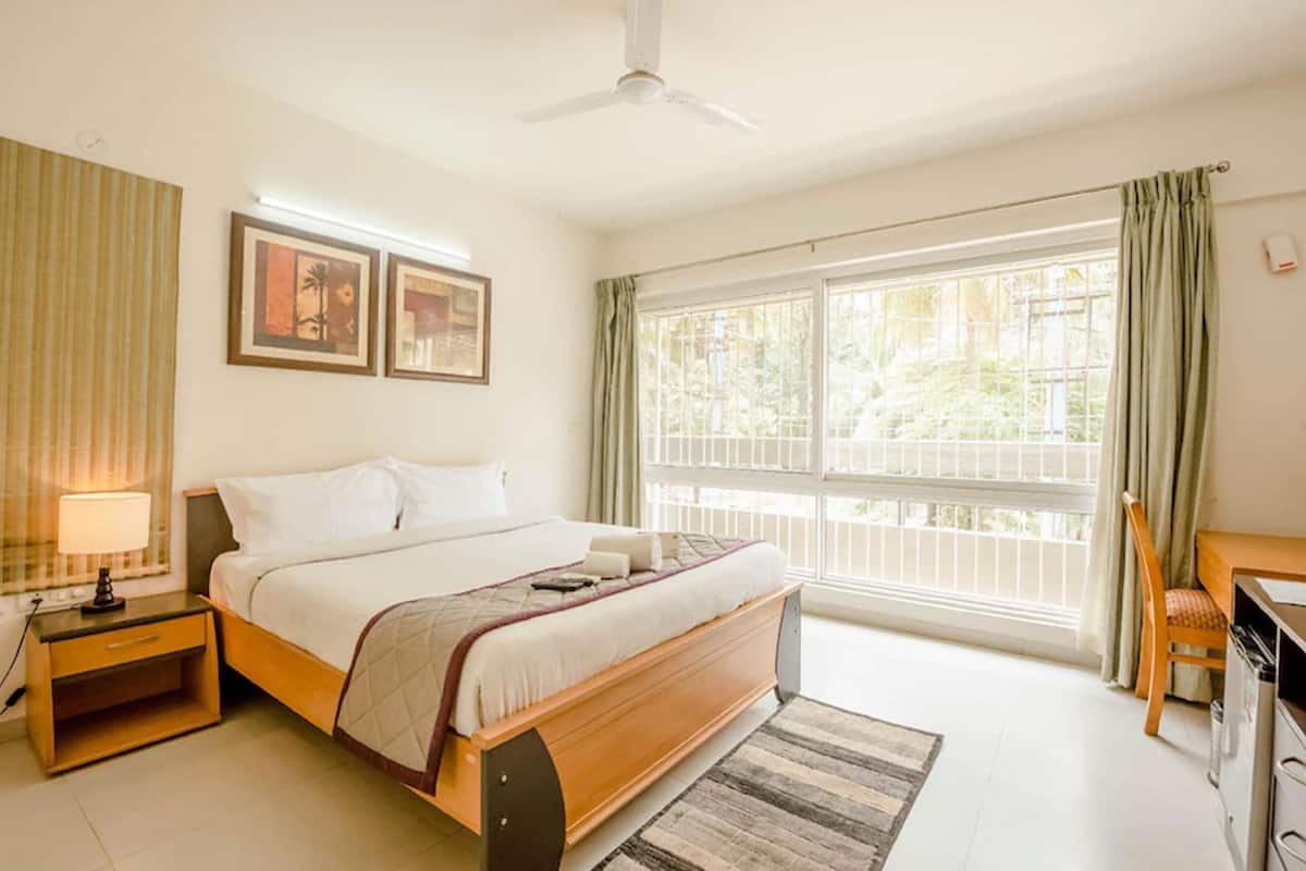 Suite studio Deluxe | Draps en coton égyptien, literie de qualité, décor unique