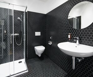 Luxury Studio Suite | Bathroom | Shower, designer toiletries, hair dryer, towels