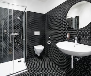 Luxury Studio Suite | Bathroom | Shower, designer toiletries, hair dryer, towels