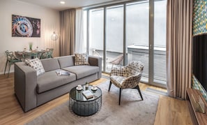 Apartment | Living area | 50-inch Smart TV with satellite channels, TV, Netflix