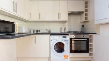 Apartment | Private kitchen | Fridge, microwave, stovetop, high chair