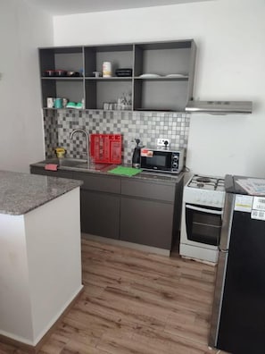 Fridge, microwave, stovetop, cookware/dishes/utensils