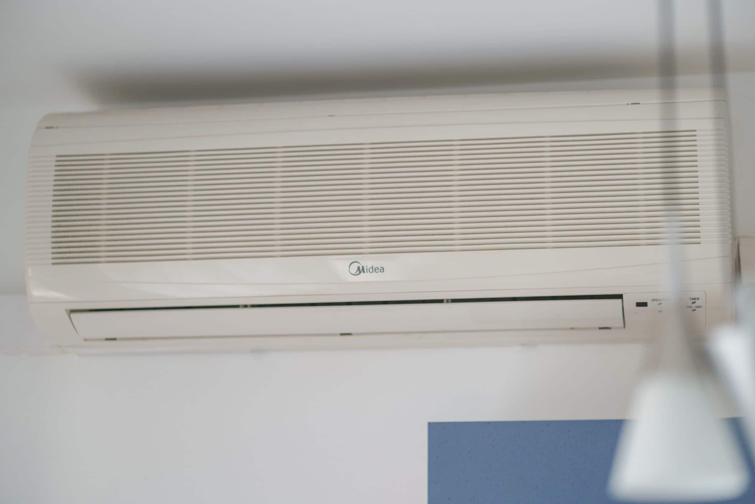 A white Midea air conditioner mounted on a wall.
