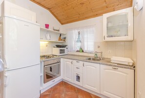 Cozinha privada | Geladeira, fogão, cooktop, máquina de café expresso