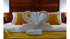 Snuggle into a cozy retreat with a neatly made bed and inviting decor.
